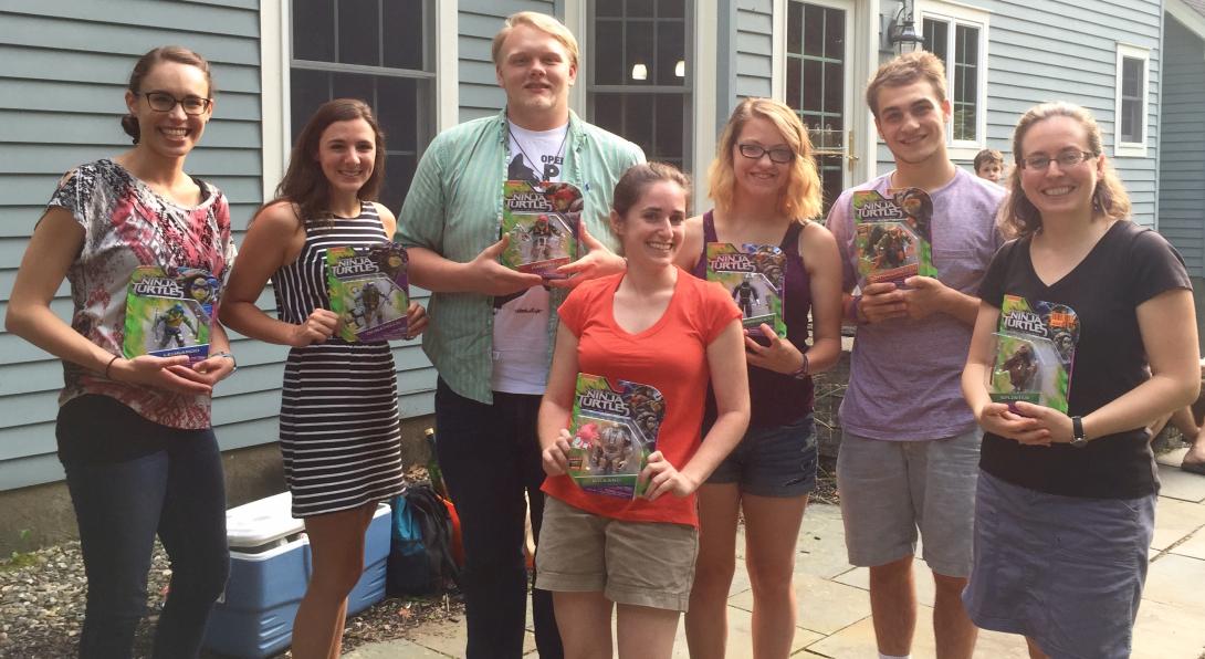 Hurley lab members holding Ninja Turtles figures
